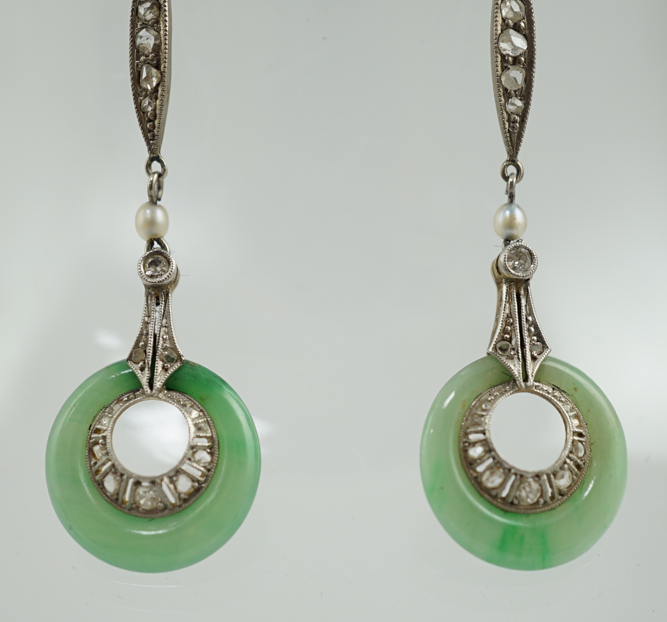 A pair of 1920's 18ct gold, diamond, seed pearl and jade disc set drop earrings
